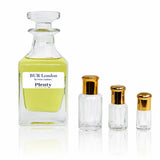 BUR London by Swiss Arabian, a floral perfume oil for women with rose, jasmine and white florals, displayed with three gold-capped attar bottles