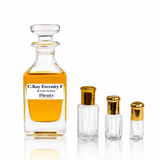 C.Kay Eternity F by Swiss Arabian, an Eternity Women-inspired floral perfume oil for women displayed with three gold-capped attar bottles