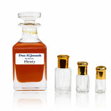 Dua Al Jannah by Surrati, a sweet tropical fruity floral perfume oil for women and men, displayed with three gold-capped attar bottles