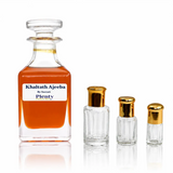 Khaltath Ajeeba by Surrati, a rich oud perfume oil for men with rose, ambergris and warm woods, displayed with three gold-capped attar bottles